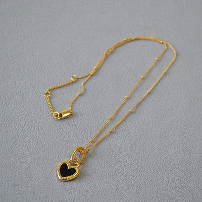 Ofelia | Black and white heart necklace in gold