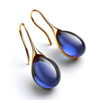 Guadalupe | Crystal dangling earrings in gold and silver.