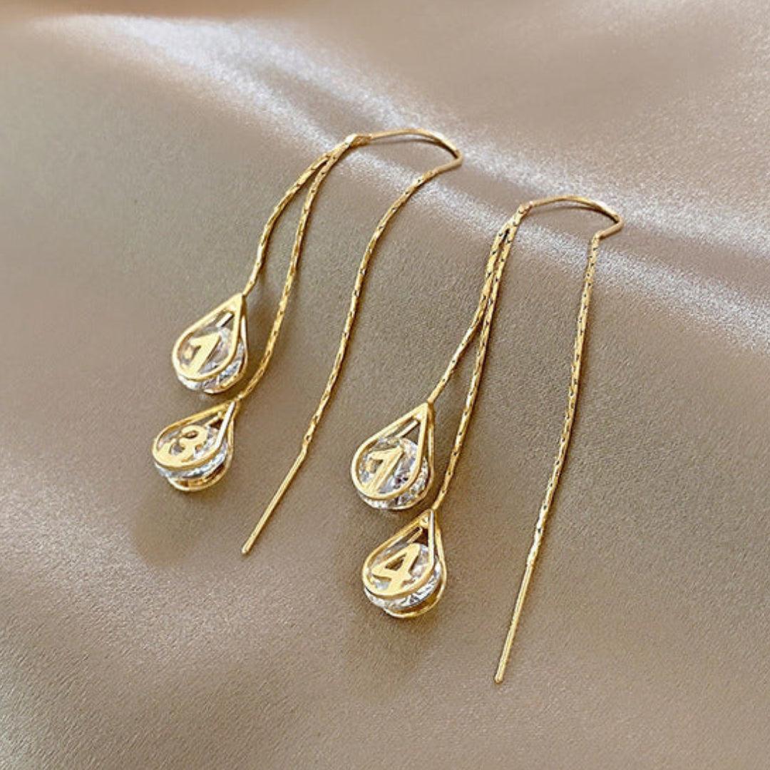 Fiorella | Golden number earrings