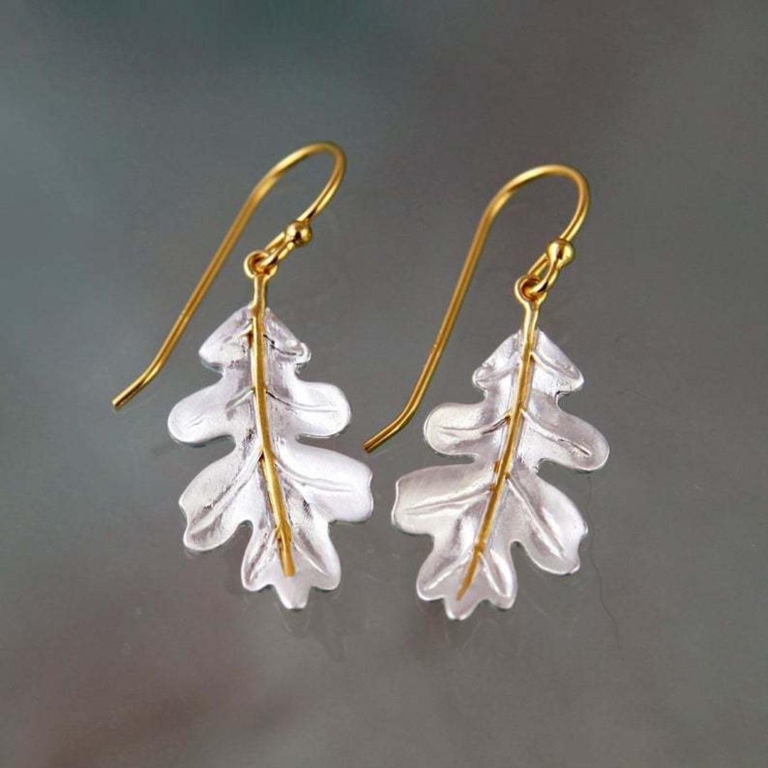 Debora | Gold bohemian earrings with white leaves