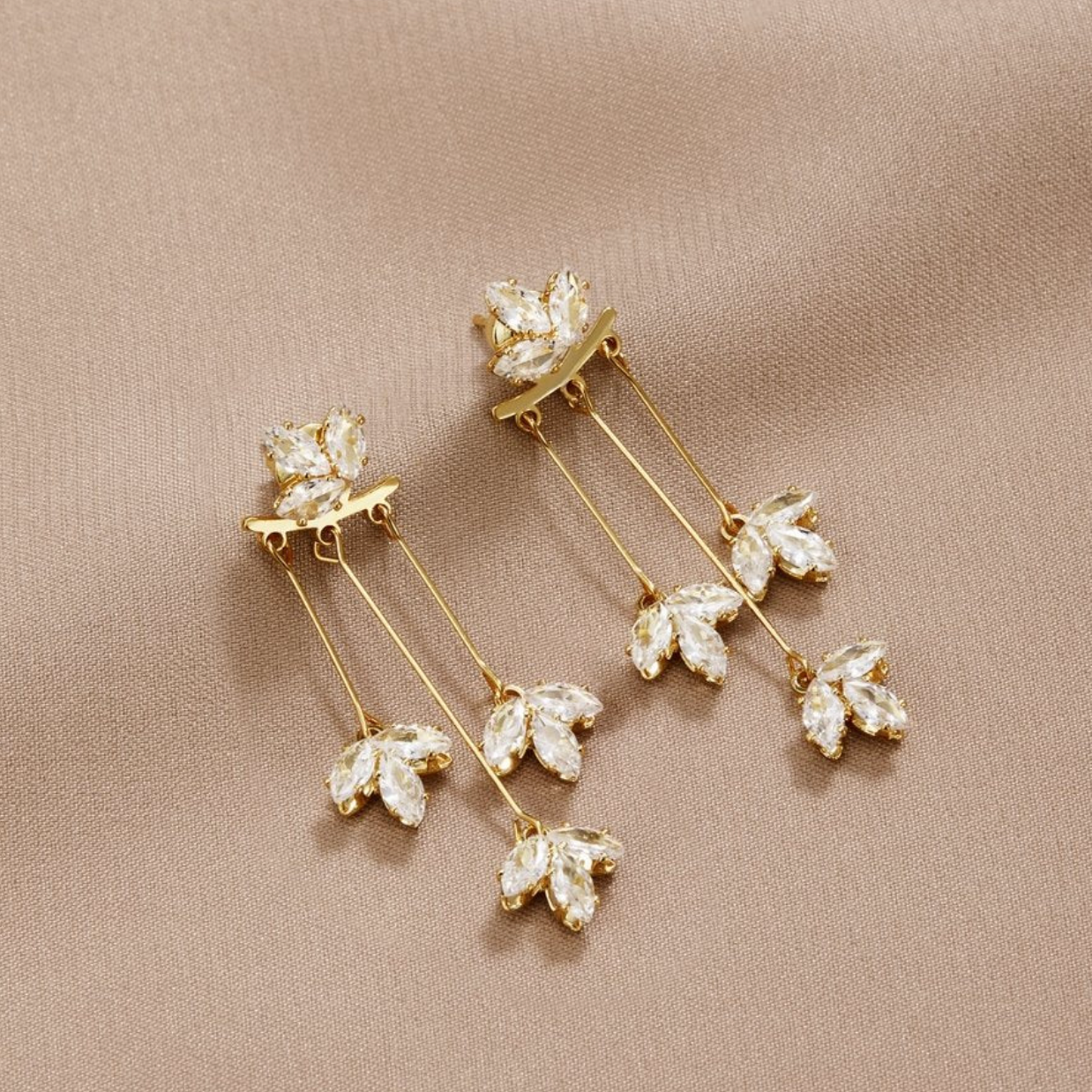 Helga | Crystal leaf earrings in gold