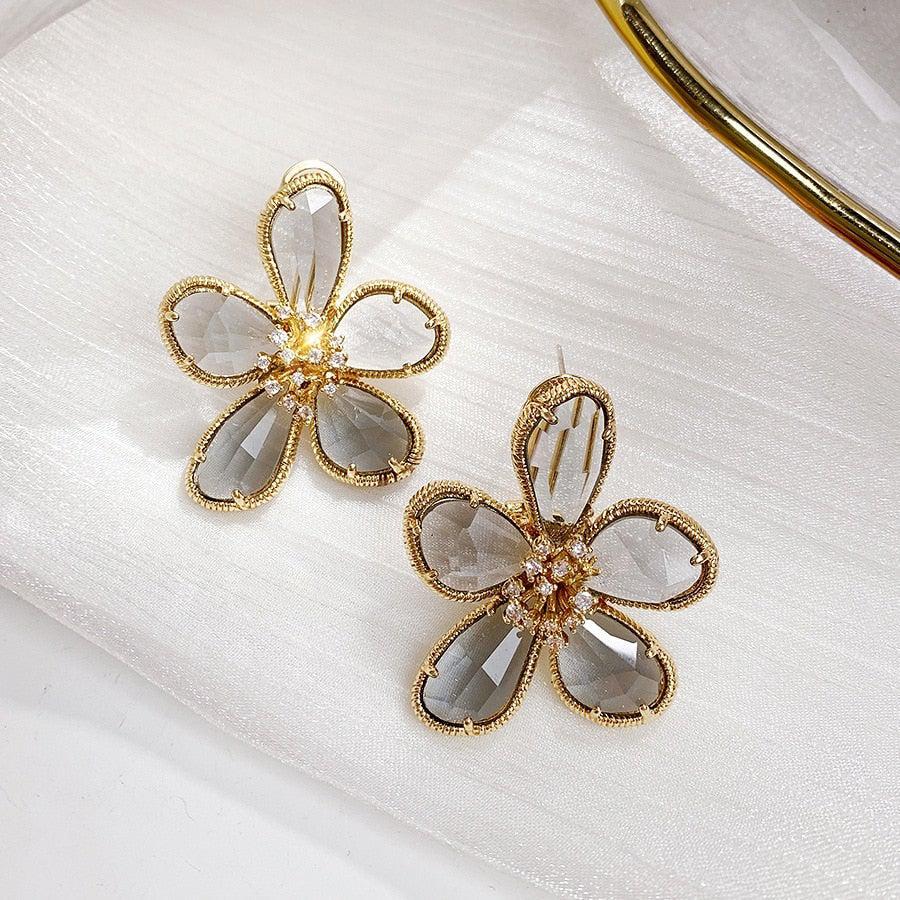 Nicol | Twisted earrings inlaid with zircons and flower of wealth