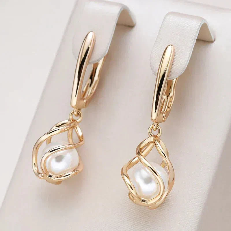 Karol | Elegant golden pearl earrings