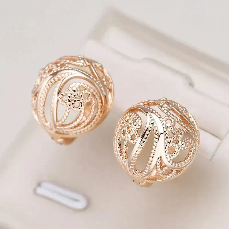 Matilde | Elegant hollow ball earrings in gold