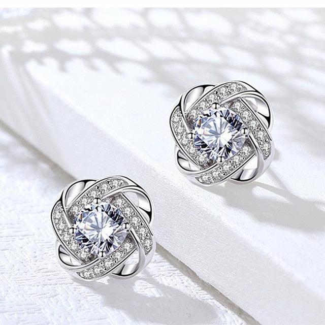 Dayana | Spiral cross earrings with flowers
