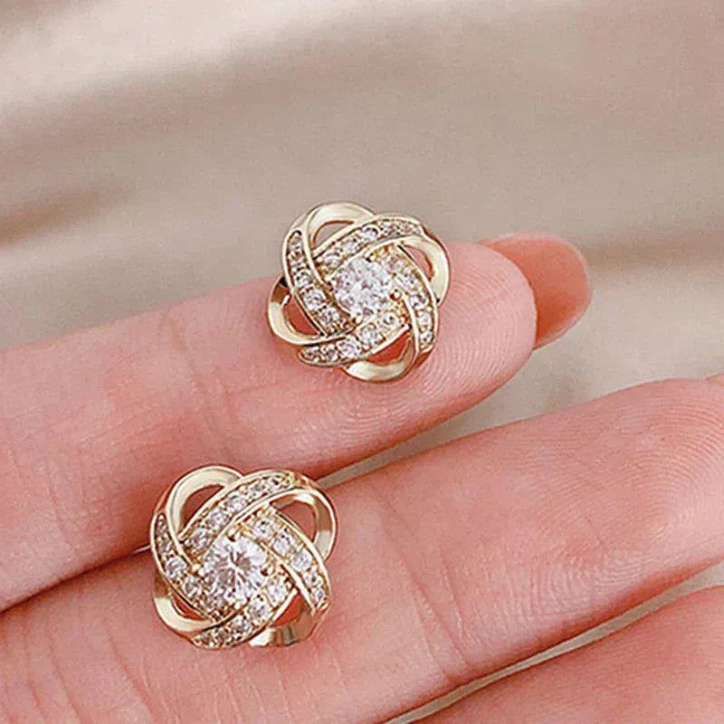 Dayana | Spiral cross earrings with flowers