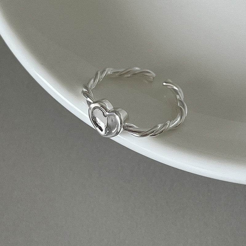 Zaida | Delicate silver ring with heart detail.