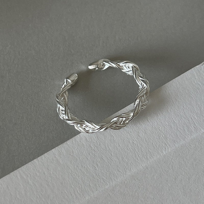 Harriet | Braided silver ring with intricate design.
