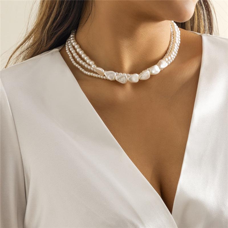 Olga | White stone and pearl necklace in gold