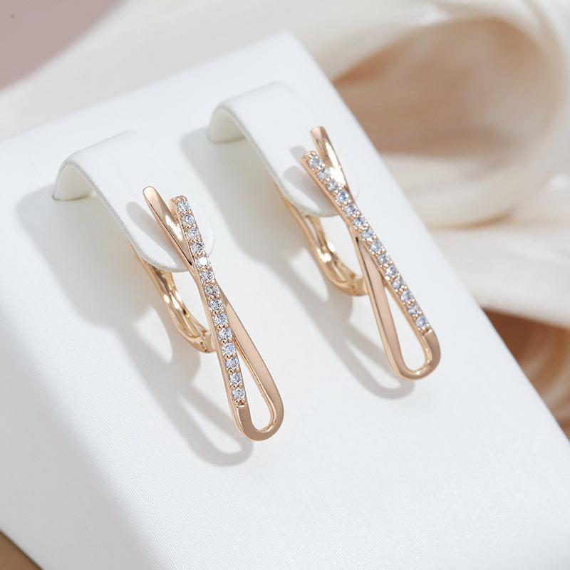 Clara | Crossover diamond earrings in gold