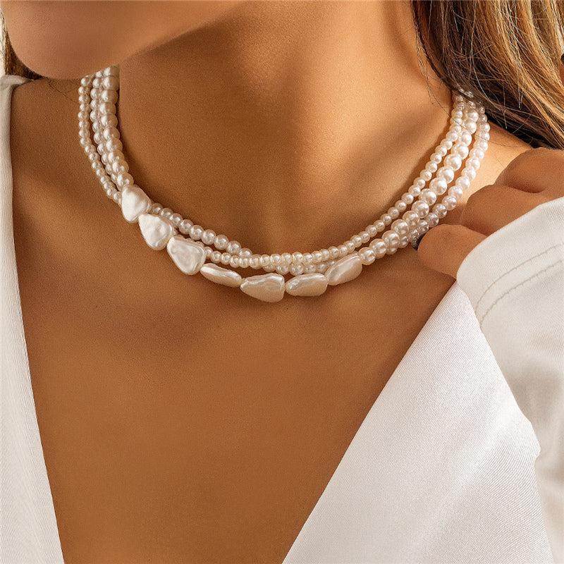 Olga | White stone and pearl necklace in gold