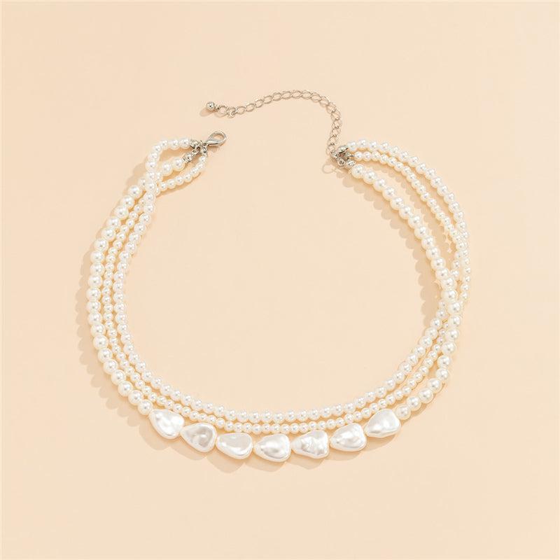 Olga | White stone and pearl necklace in gold