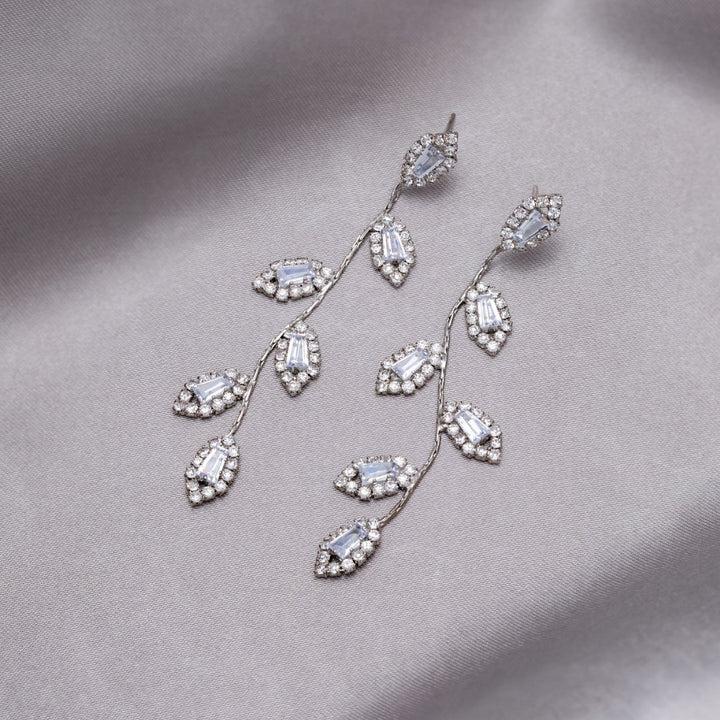 Pilar | Zirconia leaf dangle earrings in gold and silver