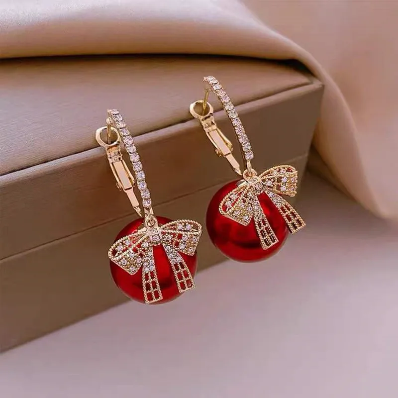 Amparo | Elegant red beaded earrings with bow
