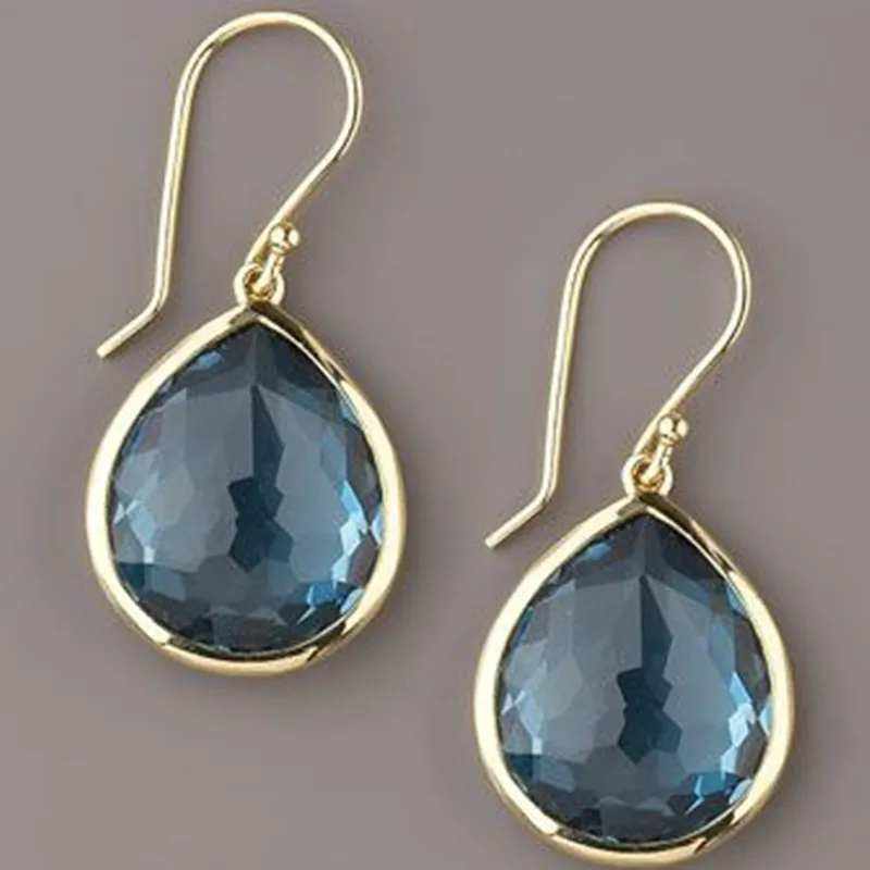 Xochitl | Blue crystal dangling earrings in gold